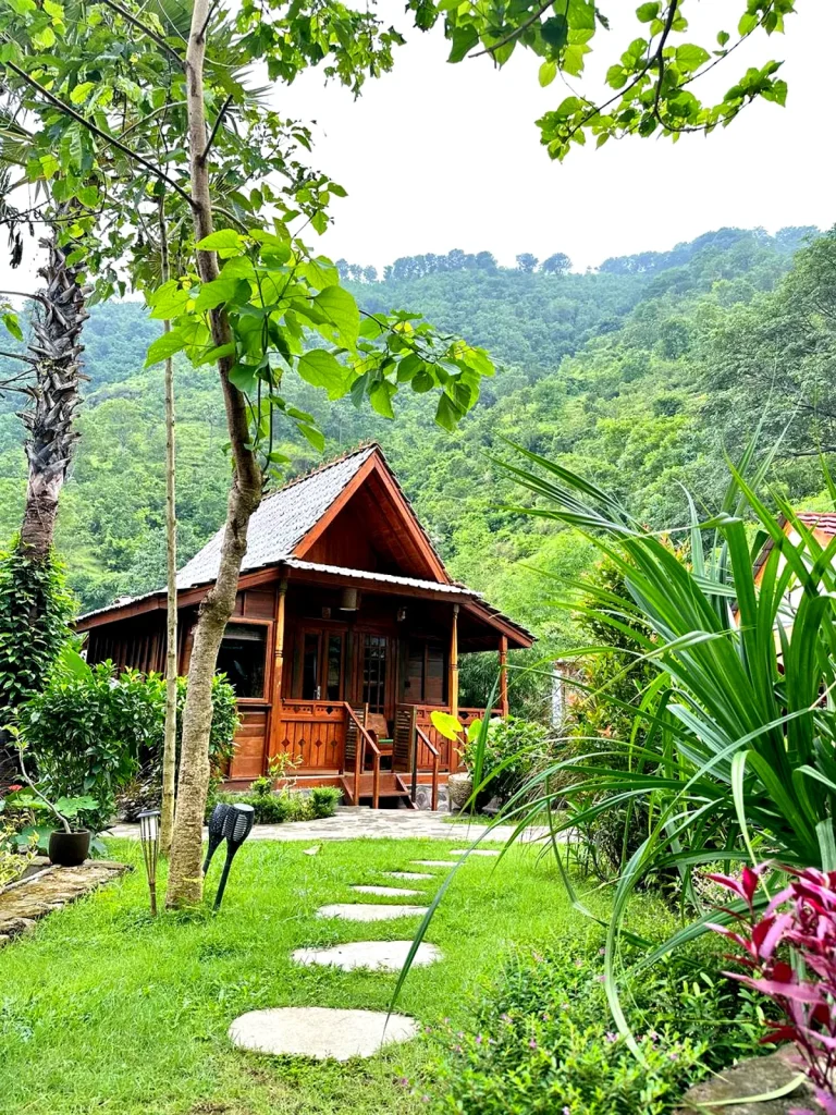 Cozy wooden hut surrounded by tropical jungle in the hills of Amed, Bali